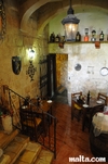 Stairs and tables of the Grotto tavern Restaurant